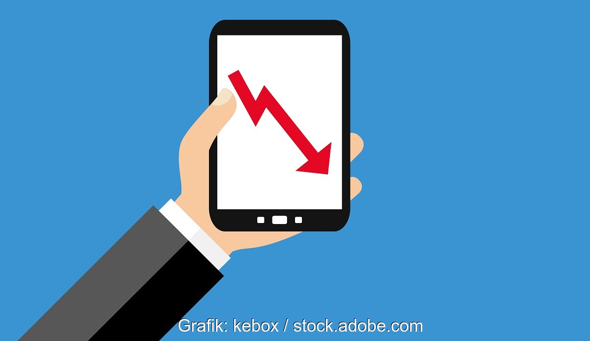 Hand mit Handy und roter Kurve nach unten, Handel mit Meyer-Burger-Aktien endet.