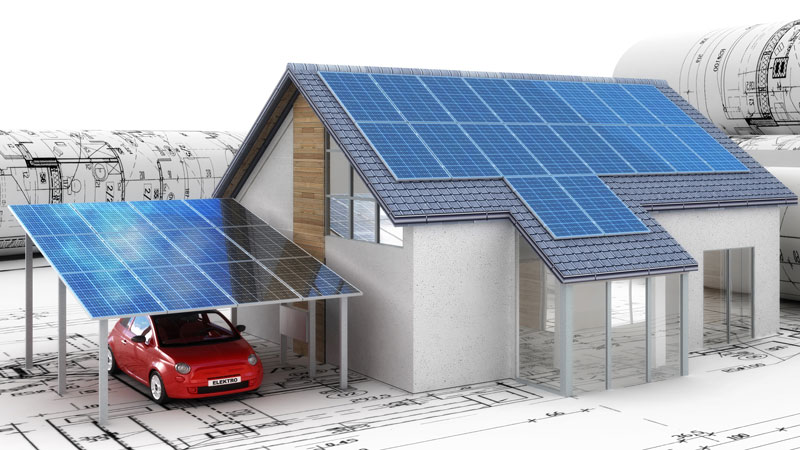 Modell eines Einfamilienhauses mit Solardach und SOlar-Carport auf Bauplänen.