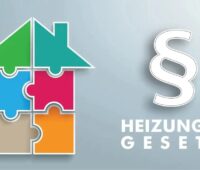 Ein Hausumriss aus Puzzlesteinen mit der Aufschrift Heizungsgesetz, der Entwurf für das neue Heizungsgesetz, das Gebäudemodernisierungsgesetz (GModG) heißen soll, liegt vor.