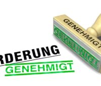 Im Bild ein Stempel mit der Aufschrift Förderung als Symbol für die neue Bundesförderung Aufbauprogramm Wärmepumpe (BAW).