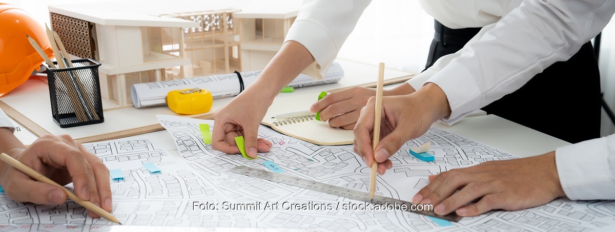 Im Bild eine Karte mit Gebäuden als Symbol für kommunale Wärmepläne in Baden Württemberg.