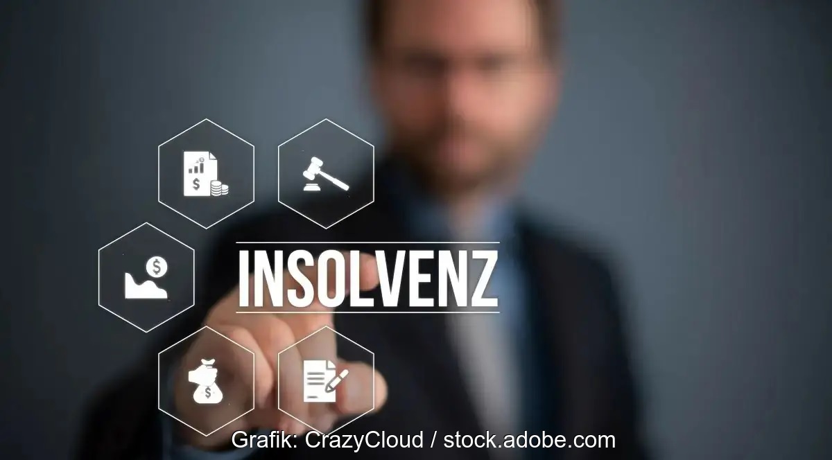 Ein Mann tippt mit dem Finger auf den Schriftzug Insolvenz.