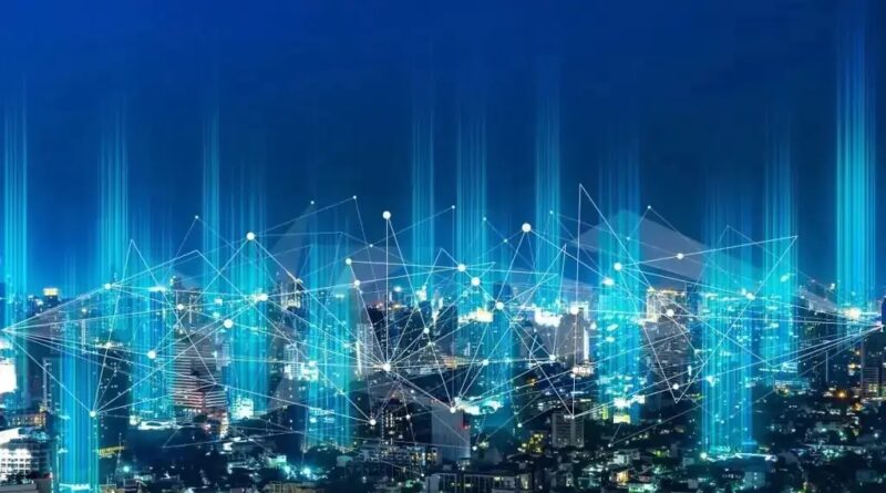 Nachtaufnahme einer Großstadt mit symbolischer Vernetzung durch Lichtpunkte, EU-Kommission will eine Roadmap für die Digitalisierung und künstliche Intelligenz (KI) im Energiesektor erstellen.