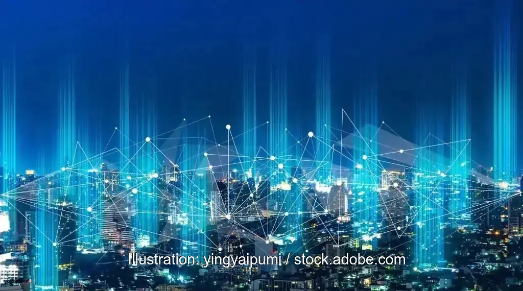 Nachtaufnahme einer Großstadt mit symbolischer Vernetzung durch Lichtpunkte, EU-Kommission will eine Roadmap für die Digitalisierung und künstliche Intelligenz (KI) im Energiesektor erstellen.