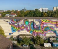 Im Bild eine mit Graffiti Fassade des Bunkers in Altona, wo klimafreundliche Wärme erzeugt werdne soll.