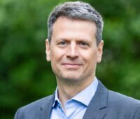 Portraitfoto von Martin Bialluch, Vorstandssprecher des Bündnis Bürgerenergie