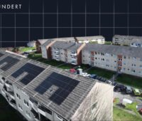 Visualisierung eines Wohnquartiers nach energetischer Sanierung mit PV.