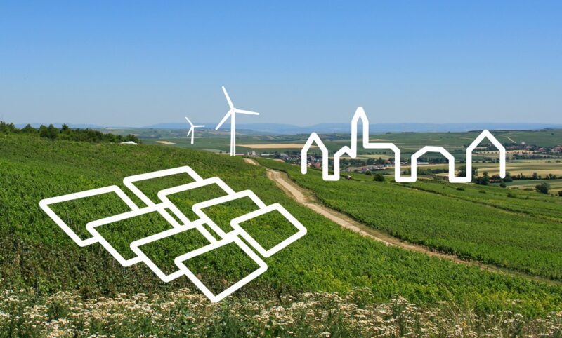 Zu sehen ist eine Wiese mit angedeuteten PV-Modulen und Windrädern als Symbol für den Nah&Grün-Tarif.